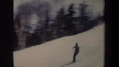 New York USA (1962): A Person Skating The Mountain Surrounded By Snow And Watching