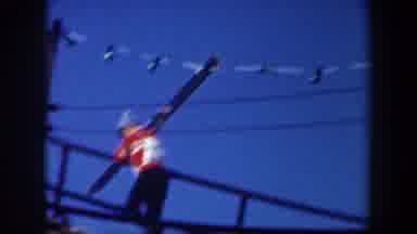 New York USA (1962): Man Climbing With A Skiing Board