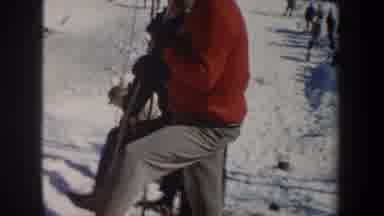 New York USA (1962): Person Skiing Down A Slope And Making A Big Jump With People