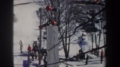 New York USA (1962): Red Lamps On A Ski Slope; A Skier Falls In The Background