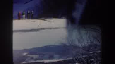 New York USA (1962): Snowy Mountains And A Athletes Skier Jumps During A Skiing