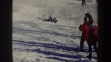 New York USA (1962): Man Adventurously Skis From A Hilltop And Tumbles To The End