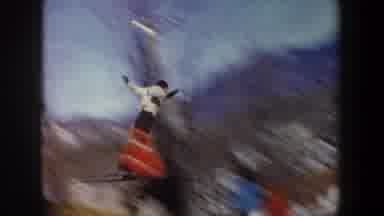 New York USA (1962): Crowd Watches As Olympic Skier Makes A Small Jump At The