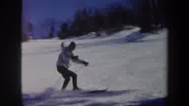 Vermont USA (1962): Skier Finishing Down The Main Track Surrounded By Trees And