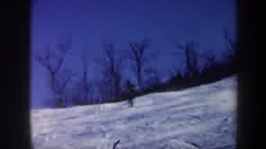Vermont USA (1962): A Person Quickly Skiing Down A Slope With Trees In The