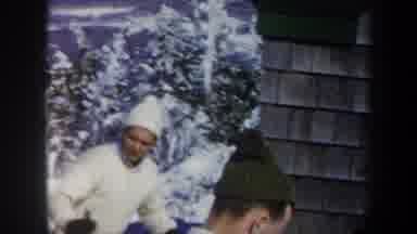 Vermont USA (1962): Two Men Ski Down A Snowy Mountain While One Of Them Is Smoking