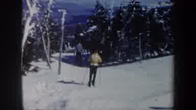 Vermont USA (1962): Two People Slowly Skiing Down Slope Between The Trees