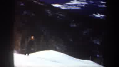 Vermont USA (1962): Person Wearing Black Shirt And Pants Sliding Downhill On Ski