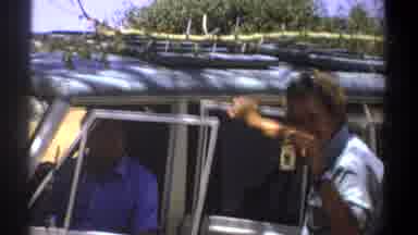 Kenya (1969): Man Attempts To Show Something To Elephant - Possibly A Badge- And