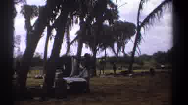Kenya (1969): African Man Standing In Jungle Area Folding Linens