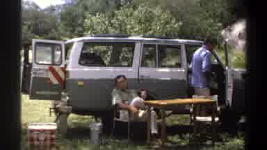 Lagos Nigeria (1969): Two Men Relax At Their Campsite With Their Vehicle In The