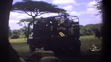 Lagos Nigeria (1969): Male Workers Unloading Heavy Cargo From Open Truck In Field