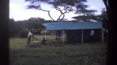 Lagos Nigeria (1969): There Are Five Man Around The Tend And They Are Make The