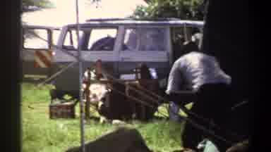 Lagos Nigeria (1969): Man Setting Up A Structure In An Outdoors Setting On A Sunny