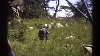 Lagos Nigeria (1969): Hunched Man With His Back To The Camera Using A Primitive
