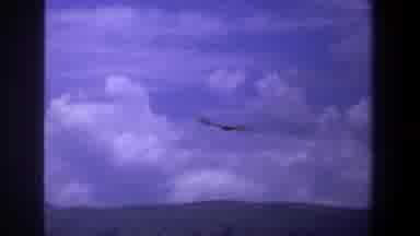 Pretoria South Africa (1969): Large Bird Flying High Through Windy Dark And Cloudy