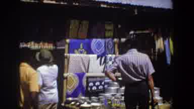 Pretoria South Africa (1969): People Look At Fabrics In A Market