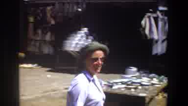 Pretoria South Africa (1969): A Woman In A Hat Walks Around A Marketplace