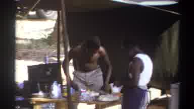 Cape Town South Africa (1969): 2 African Men Preparing Food By An Outdoor Campfire