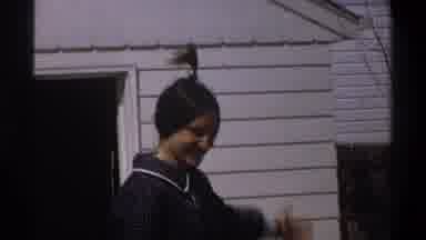 Cape Town South Africa (1969): A Girl With Her Hair Bunched Up Is Showing Off Her