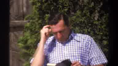 Cape Town South Africa (1969): A Man Reading A Book On His Backyard