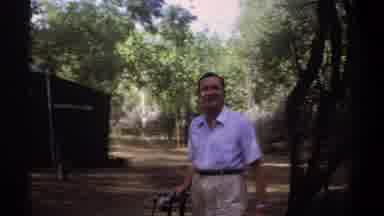 Khartoum Sudan (1969): A Man Holding A Camera Walks Out Onto A Trail In Front Of A
