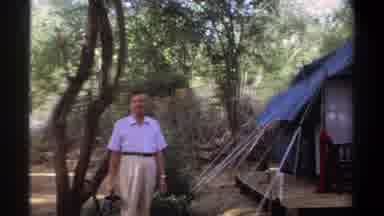 Khartoum Sudan (1969): Man Standing By Huge Camping Tent In The Forest