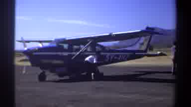 Khartoum Sudan (1969): Old Footage Of A Man Checking A Prop Airplane's Mechanical