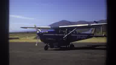 Khartoum Sudan (1969): Blue Propeller Airplane Pilot Checking Wing Airfield Runway