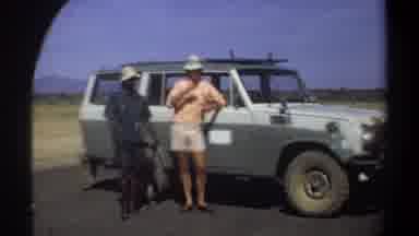 Khartoum Sudan (1969): Two Black Men And One White Man Talk Next To A Vehicle