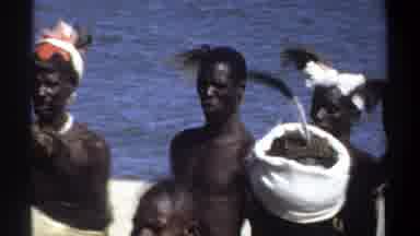 Khartoum Sudan-1969: Men Women African Headdress Feather Near Water Jewelry Ribs