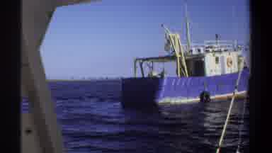 KHARTOUM SUDAN-1969: Blue Fishing Boat On Calm Sea From Nearby Vessel
