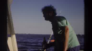 Khartoum Sudan (1969): Man Wearing Green Shirt Standing On Boat Holding Bottle On