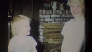 Troy New York USA (1973): Girl Talking To The Boy Who Puts His Hands To His Ear