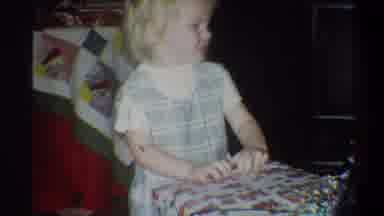 Troy New York USA (1973): Girl Fiddling In A Gift Package With Her Striped Dress