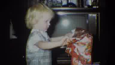 Troy New York USA (1973): A Small Child Standing In Front Of A Tv Opening A