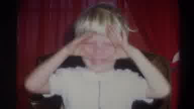Troy New York USA (1973): Kid Making A Funny Face At The Camera Then Turns To