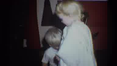 Troy New York USA (1973): Home With Person Outside Two Small Children Wearing