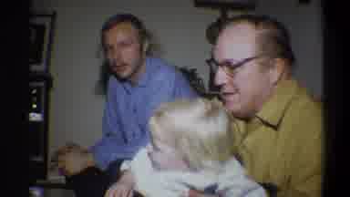 Troy New York USA (1973): The Men Play With The Child