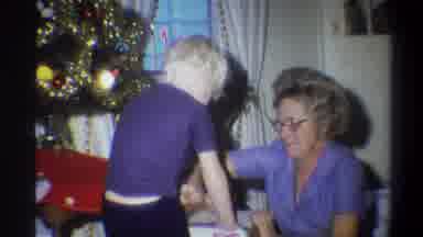 Troy New York USA (1973): One Small Boy Open The Gift In Christmas Day Time