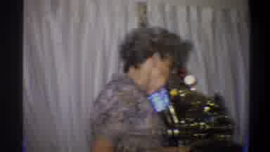 Troy New York USA (1973): Older Family Member Explaining Part Of A Gift At