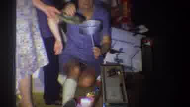 Troy New York USA (1973): A Woman That Is Sitting Puts A Lid Down As A Baby Drinks