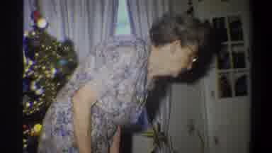 Troy New York USA (1973): An Elderly Woman Looks Down At The Floor Next To A