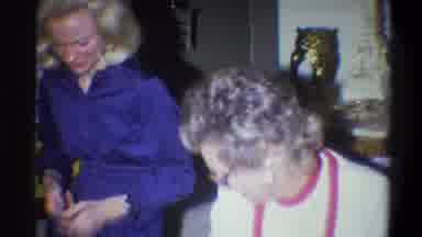 Troy New York USA (1973): A Family Gathers As Group And Celebrates By Opening Some