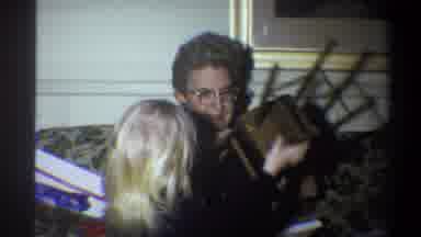 Troy New York USA (1973): Little Girl Passing Wooden Baby Doll Chair To Grandma On