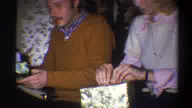 Troy New York USA (1973): Man Wearing Brown Sweater And Woman Wearing White
