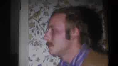 Troy New York USA (1973): Man Speaking To Someone And Smiling In Front Of Tacky