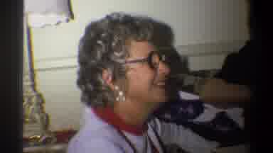 Troy New York USA (1973): Older Woman Opens Package As Second Woman And Child