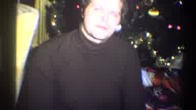 Troy New York USA (1973): Man Wearing Brown Shirt Sitting Next To Christmas Tree