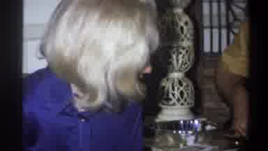 Troy New York USA (1973): Blonde Haired Women Watches Yellow Shirted Man While A